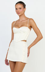 Quilla Mini Skirt - Mid Waist Faux Button Front Skirt in Cream